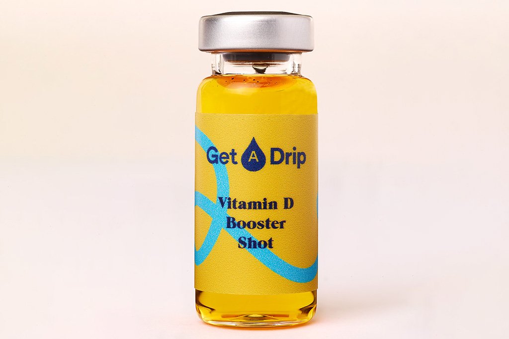 Vitamine D Booster Shot met een heldere achtergrond