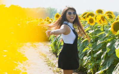 Lady in sunflower field