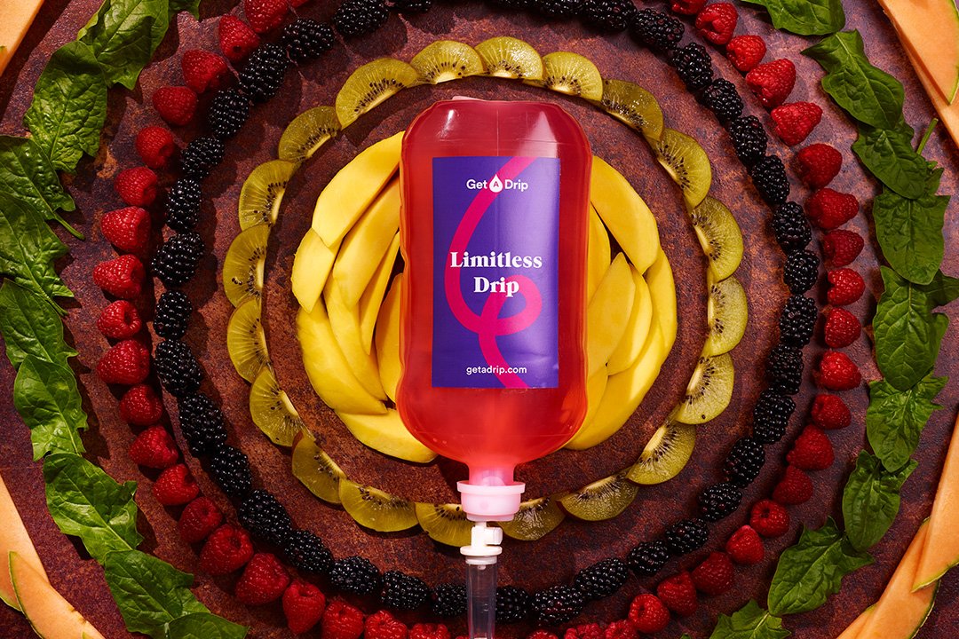 Limitless vitamin drip surrounded by fruit
